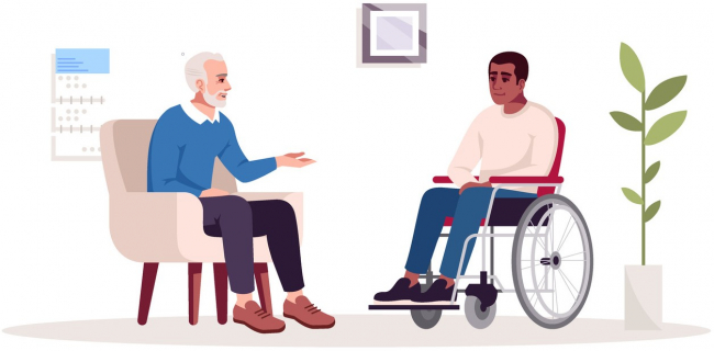 Man counseling a man in a wheelchair with trauma issues